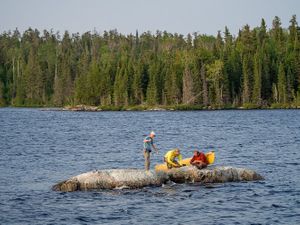 Cleaning fish on an island just off Camp