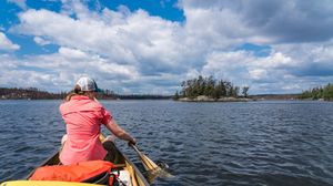 Paddling Lightning Lake. Note only some islands are unburned here.