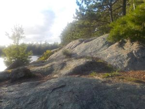 Large rock in front of site.