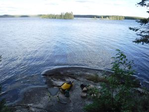 Campfire fire pit down by lake looking east