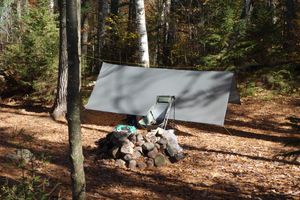 Tarp set-up and fire ring at campsite #2