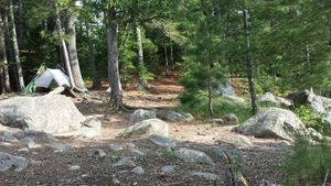 View south from kitchen area toward latrine