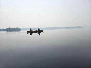 Smoke over glassy water
