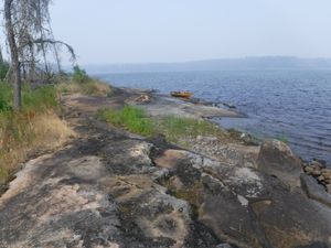 Burned Burntwood Lake campsite looking west