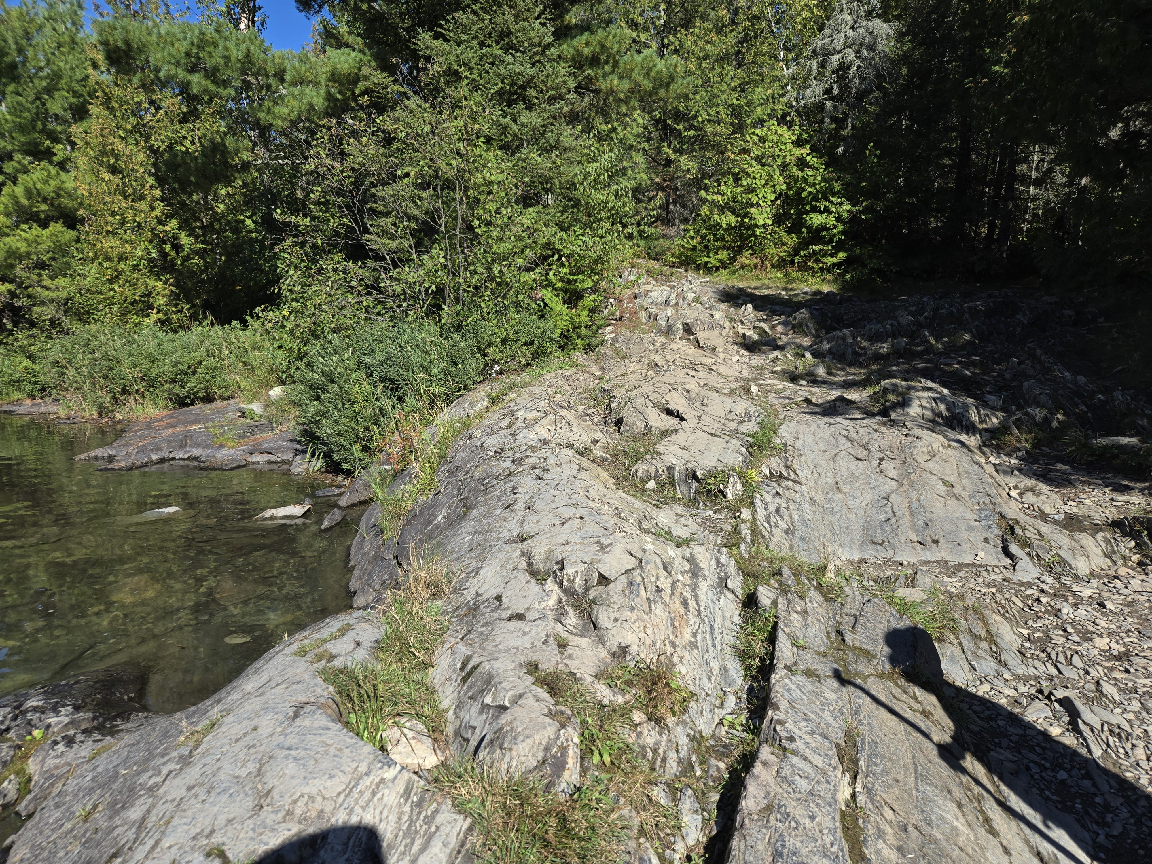 Large rock at western end of portage