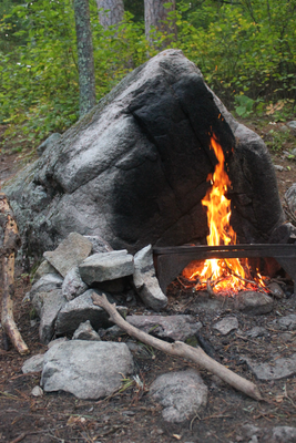 Rocky lake campsite fire grate area